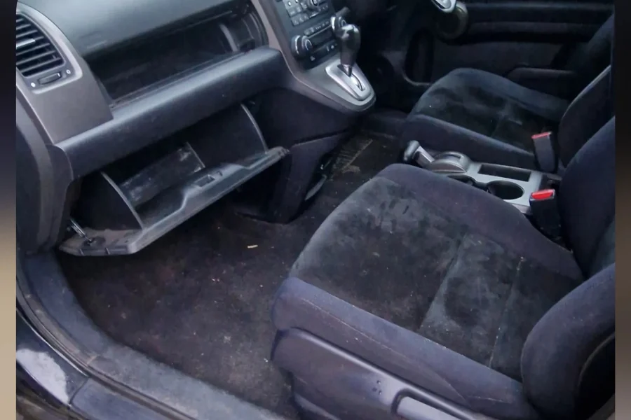 Dirty Honda CR-V passenger side with stained seats and grimy floor before interior valet by Hydrowax