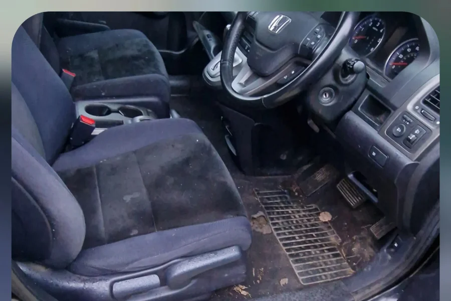 Heavily soiled Honda CR-V interior with dirty seats and muddy carpets before full valet by Hydrowax