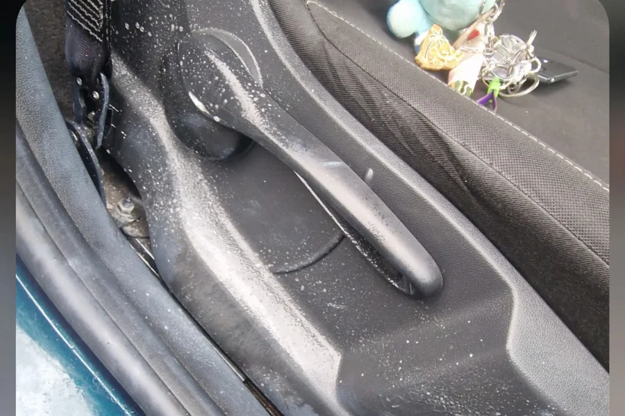 Grimy car door panel with salt residue and dirt before interior valet by Hydrowax