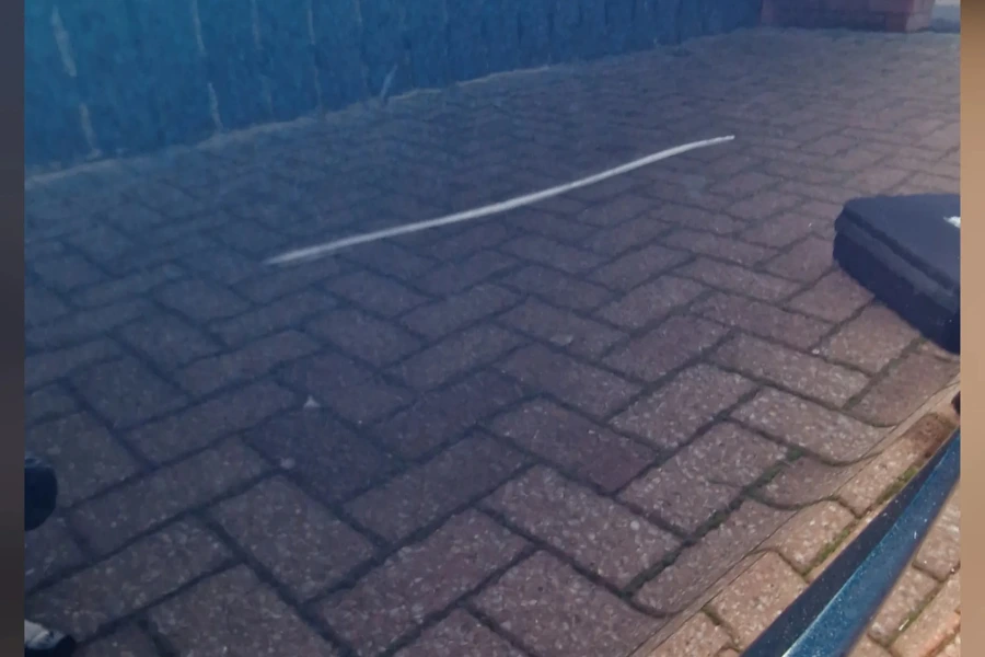 Visible scratch running along dark car bodywork before paint correction by Hydrowax